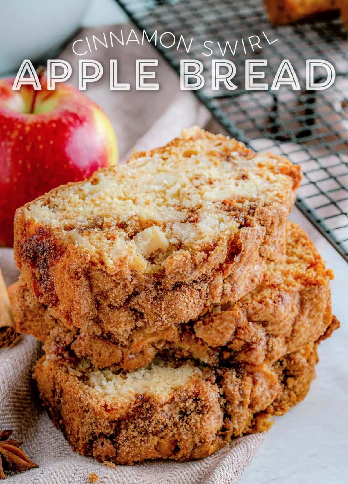 Freshly baked Apple Bread with slices and apples on a wooden table